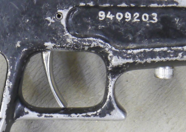 Badger serial and stainless trigger close up.