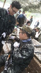 Showing off teammates equipment.