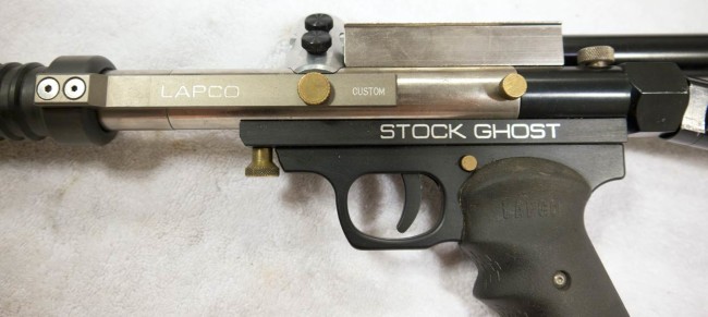 Close up of left side of stock ghost showing engravings.