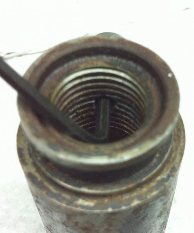 Top rear shot of the allen screwing in the piercer.