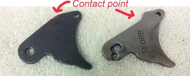Rounded nelspot 007 trigger plate and a Skorr trigger plate