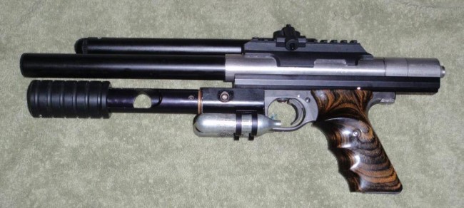 Automag pistol with the pump 12 gram changer left side.