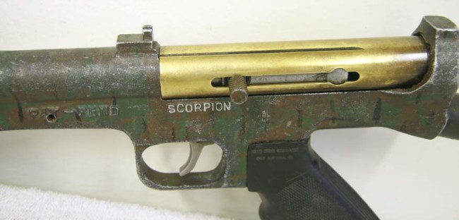 Angled shot showing the sight rail and sight notch on the PSI Scorpion.