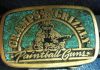 Lou "Gramps" Grubb's Gramps and Grizzly belt buckle. With inlaid turquoise.