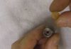 Installing a sheridan 12 gram face seal that seals a pierced 12 gram cartridge.