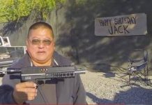 Jack Wada looks over the new stock class Carter Machine Box gun that his kids bought for his birthday.