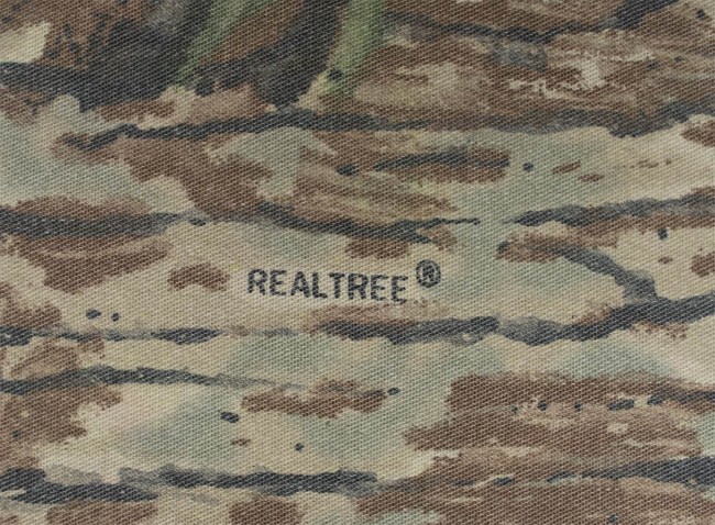"Realtree®" logo incorporated into camouflage of pullover.