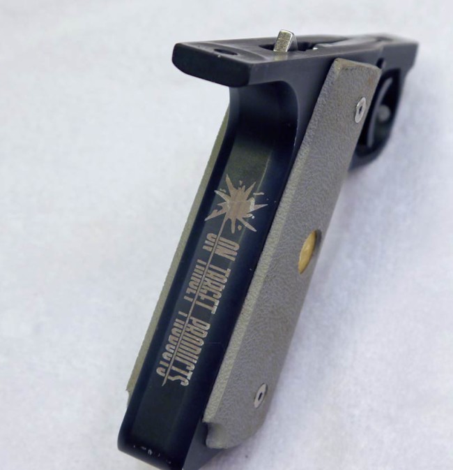 Back strap of OTP engraved Benchmark frame with engraving on back strap shown.