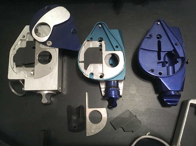 Three trap door / feed block assemblies from the Alien Revelation.