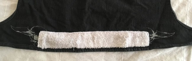 Back of Sandana hear wrap portion with terry cloth behind it. Fly skulls are silk screened on the back portion under the terry cloth as well.