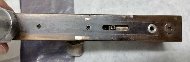 Bottom of body with rootbeer finish and even some black anodizing remaining.