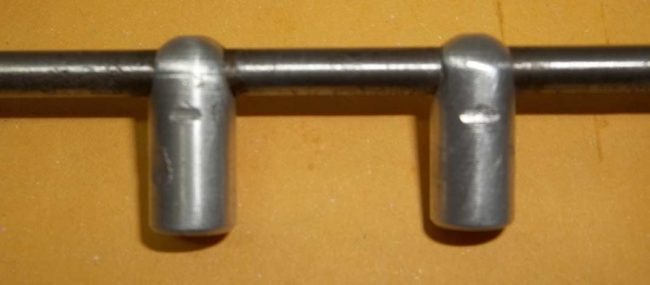 Side view of auto trigger stops.