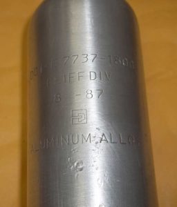 Polished 10oz tank exterior reveals date of 8-1987.