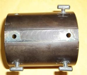 Rootbeer brown faded wire stock tank holder bracket. Top side view (notch fits Sheridan frame compatible wire stock).