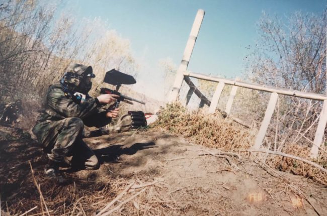 Coleman shooting his Autococker while playing with the Bushwackers. Fridge in background laying down. Photo courtesy John Coleman.
