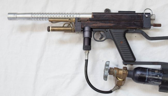 Right side view of this Autococking Sniper 1. No inline High Pressure Regulator was used on these early models and the co2 was directed from the tank directly into the vertical asa through a plastic coated line.