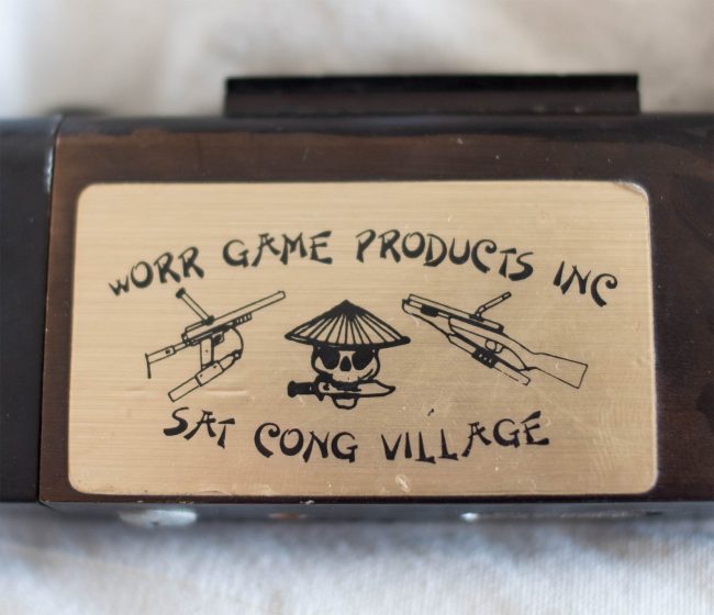 Close up on Sat Cong Village and Worr Game Products Inc. Sticker.