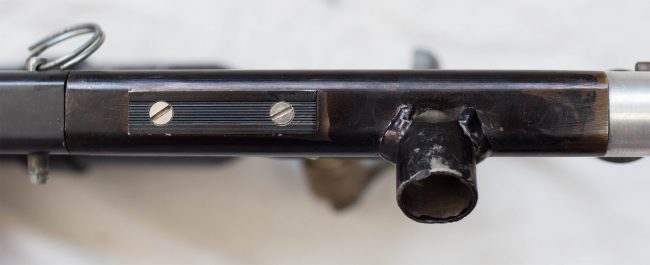 Top rail has been drilled for a sight rail. Most Sniper 1s this early did not have sight rails.