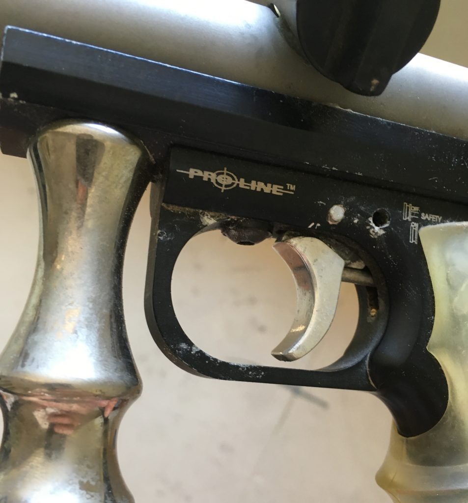 Front left side of aluminum trigger on Proline Automag frame.