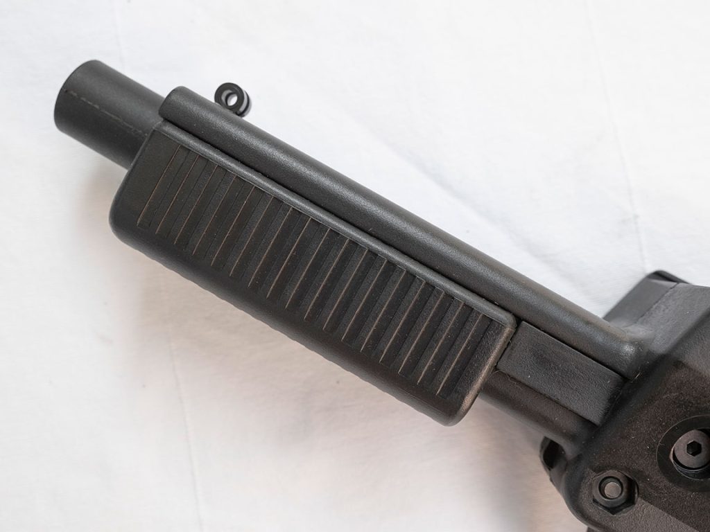 Plastic pump handle on the early Air Gun Game Supplies Mark 1 paintball pistol.