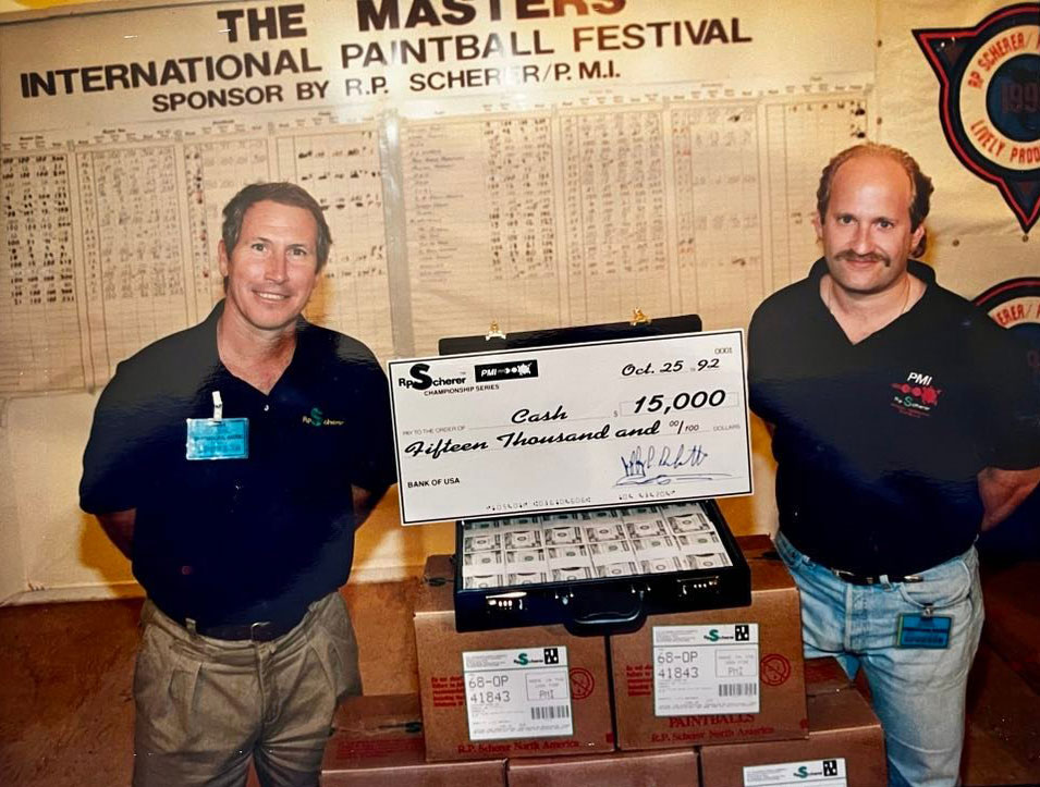 Paul Tournier (left) and Jeff Perlmutter (right) prize winnings for 1st place team at 1992 Lively Masters. Photo from the archives of Jim Lively.