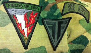 A field of Fire and field of fury patch on an old BDU.